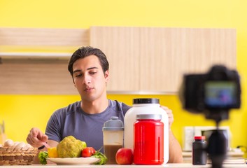 Young man blogging about food supplements