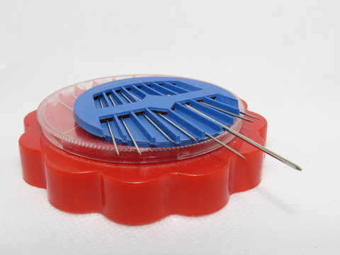 An needle case in blue and red color isolated with white background.