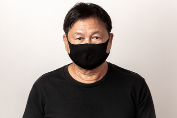Close-up face of a  Asian man wearing a mask