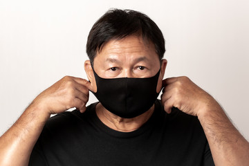 Close-up face of a  Asian man wearing a mask