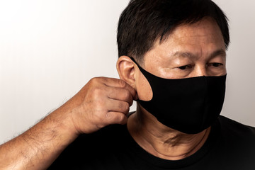 Close-up face of a  Asian man wearing a mask