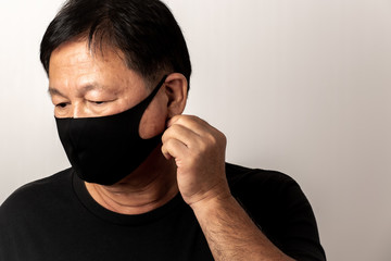 Close-up face of a  Asian man wearing a mask