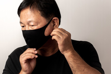 Close-up face of a  Asian man wearing a mask