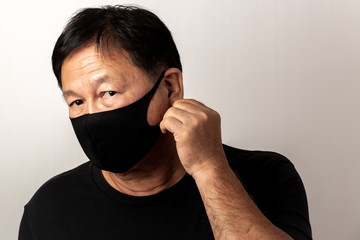 Close-up face of a  Asian man wearing a mask