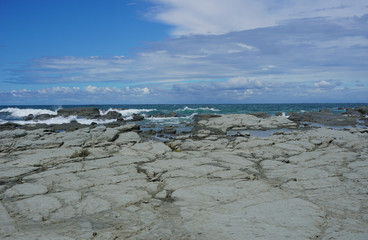 Fototapeta na wymiar Grey rocks on the shore