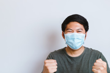 Coronavirus Covid-19 and Air pollution pm2.5 concept. man wearing mask for protect pm2.5 and show...