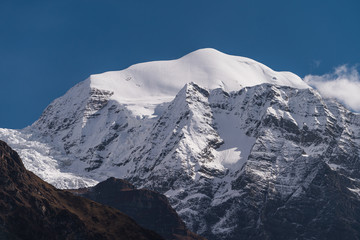 Fototapeta na wymiar Saula mountain peak view from Lho village in Manaslu circuit trekking route, Himalaya mountains range in Nepal