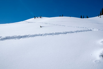 Blue sky and snow hills