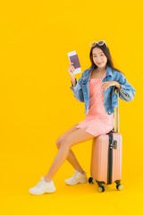 Portrait beautiful young asian woman with luggage travel bag with passport and boarding pass ticket