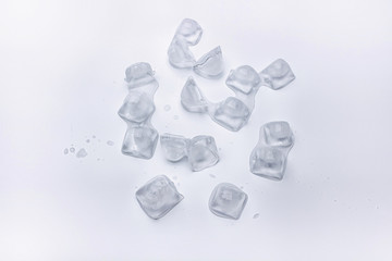 Ice cube are melting on white background with water drop