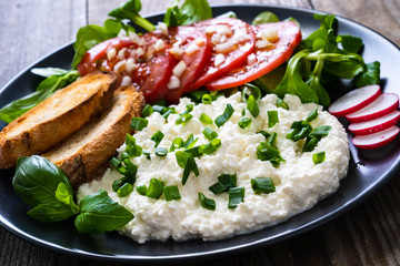 Breakfast - cottage cheese, toasted bread and vegetables
