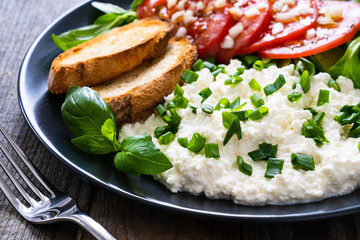 Breakfast - cottage cheese, toasted bread and vegetables
