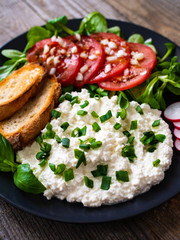 Breakfast - cottage cheese, toasted bread and vegetables
