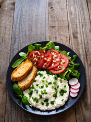 Breakfast - cottage cheese, toasted bread and vegetables
