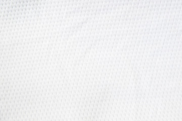 Naklejka na ściany i meble White mesh jersey fabric background. cloth sport wear texture for exercise. light weight, good air flow, cool and easy to dry from sweat. abstract wallpaper with copy space for text.