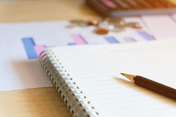 Blurred selective focus, Cost reduction calculating on financial, tax and business infographic graph pie chart. Tax and expense cost saving for personal. Economic crisis during Covid-19 pandemic