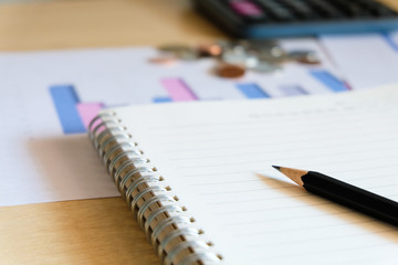 Blurred selective focus, Cost reduction calculating on financial, tax and business infographic graph pie chart. Tax and expense cost saving for personal. Economic crisis during Covid-19 pandemic