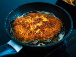 Pork chop in frying pan