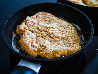 Pork chop in frying pan