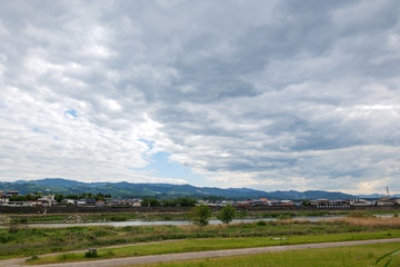 Fototapeta na wymiar Cloudy sky at the riverbank in Gojo, Nara