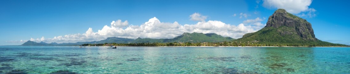 Fabulous panoramic view of the of mountains, colorful clouds and clear ocean/ Mauritius - obrazy, fototapety, plakaty
