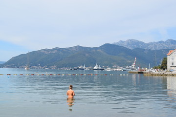 Rear View Of Shirtless Standing In Sea