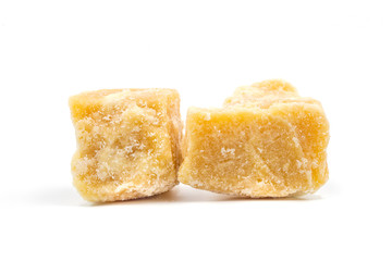 Coconut sugar cubes on white background.