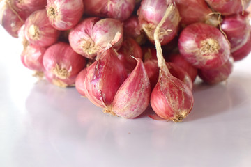 A group of red onion on white background