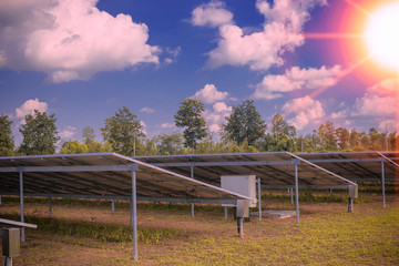 Beautiful sunset over Solar Farm with sunset on the background.