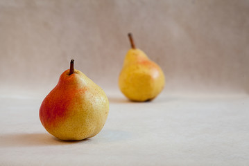 Ripe pear close-up on a gray background. Minimalism. Healthy food. Fresh food. Fruits.Vegetarianism