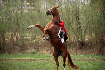 Woman jockey performs candle trick on horse racetrack