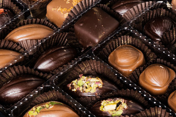 Homemade belgian chocolate. Close-up chocolate.  Religious Holiday, The Sugar Feast After Ramadan. Blurred background. Copy space for text message.