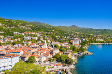 Fototapeta na wymiar Croatia, beautiful town of Lovran and sea walkway, aerial panoramic view in Kvarner bay coastline, popular tourist destination