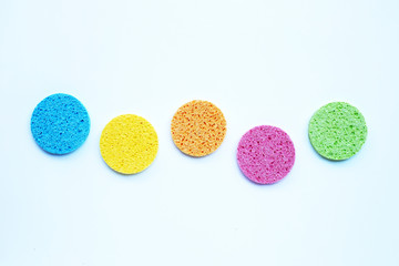 Colorful sponge for face make-up cleaning on white background.