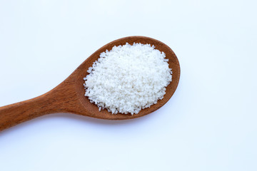 Fototapeta na wymiar Flower of salt in wooden spoon on white background.