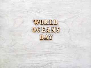World Ocean Day. Beautiful greeting card. Isolated background, close-up, view from above, wooden surface. Congratulations for relatives, friends and colleagues