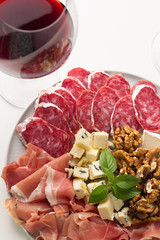 red wine and cheese and meat snacks
