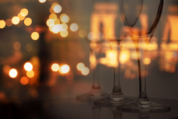 wine glass with blur party bokeh light of pub and bar dark night interior background