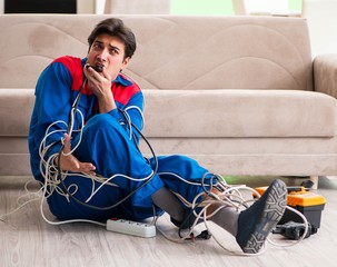 Electrician contractor with tangled cables