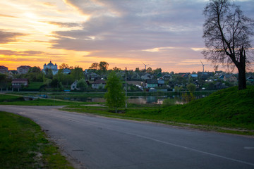 Fototapeta premium Church of the Intercession of the most Holy Theotokos at sunset. The view from the road poselok Veyno, Mogilev Belarus