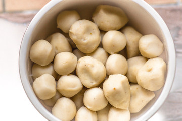 background of the cooked meat (minced pork) put in a clean container cup, for use as part of the...