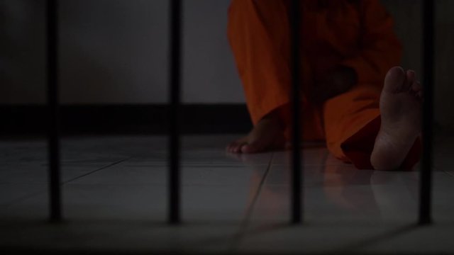 Asian woman desperate at the iron prison,prisoner concept,thailand people,Hope to be free,Serious prisoners imprisoned in the prison