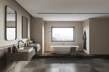 Fototapeta na wymiar Stylish beige and tiled bathroom interior
