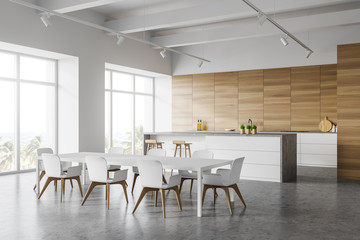 White and wooden kitchen corner with table