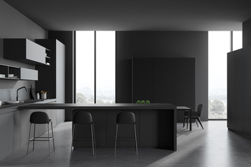 Gray kitchen with bar and table