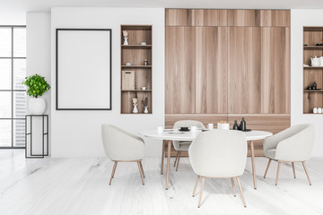 White and wooden dining room with poster