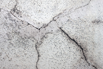 Texture of an old cracked plastered facade wall. Background. Material for 3d modeling and design.