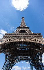 Eiffel Tower in Paris on Blue Sky Background. France. Bottom View.