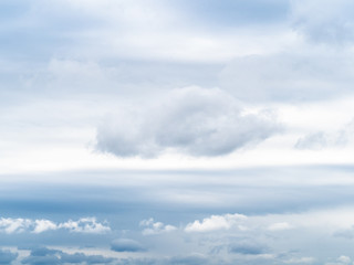 natural background - white clouds in gray sky on spring cloudy day
