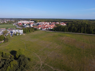Obraz premium New estate blocks of flats surrounded by fields and forests, Gdynia, Pomerania, Poland